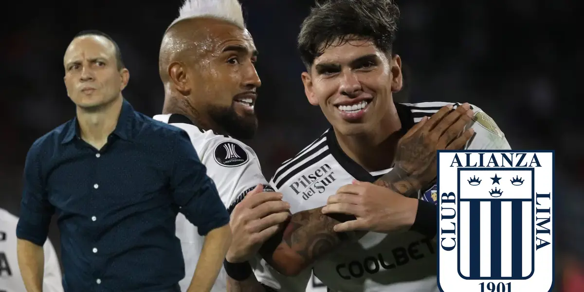 Alejandro Restrepo mirando para un costado, mientras Arturo Vidal celebra con un compañero en Colo Colo