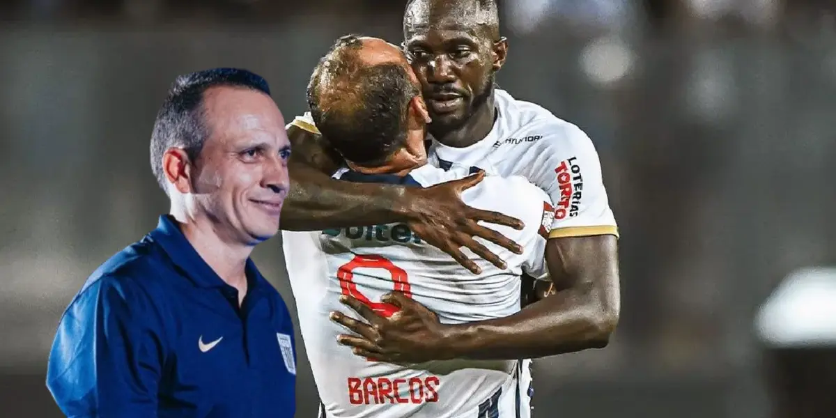 Alejandro Restrepo sonriente, mientras Waterman celebra con Barcos