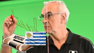 Jorge Fossati haciendo su firma en una sesión de fotos de la Selección Peruana