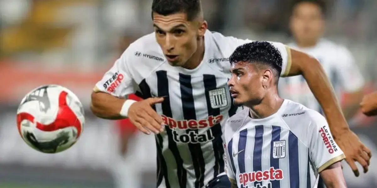 Kevin Serna luchando el balón y Jeriel De Santis mirando